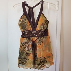 Women's sleeveless, low back shirt